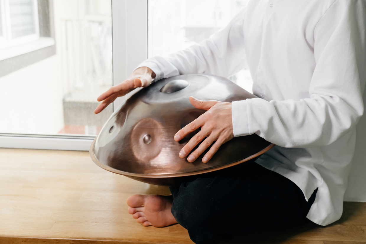 Man playing on hang drum, or Steel Drum, Hangpan