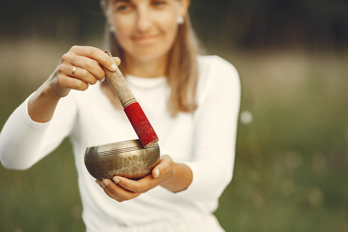 Woman Holding Chanting Bowl