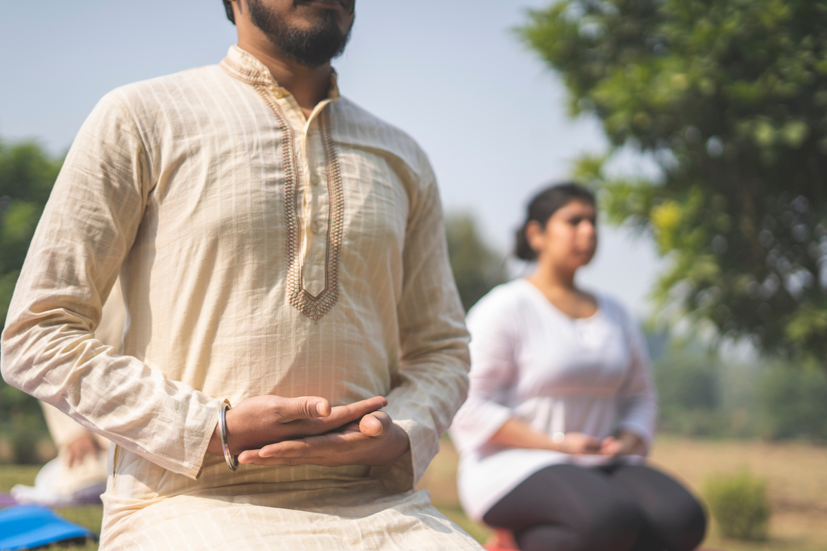 People Doing Yoga Together at the Park